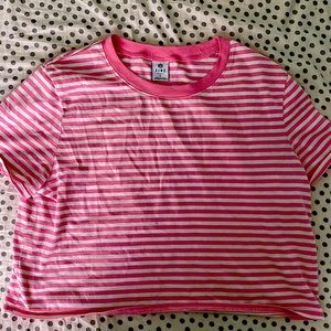 I am selling a pink and white stripped crop top.